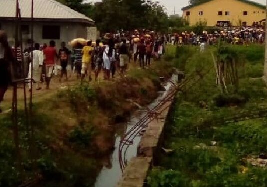 Abuja Palliative Warehouse: Three Women Feared Dead in Looting Spree Stampede