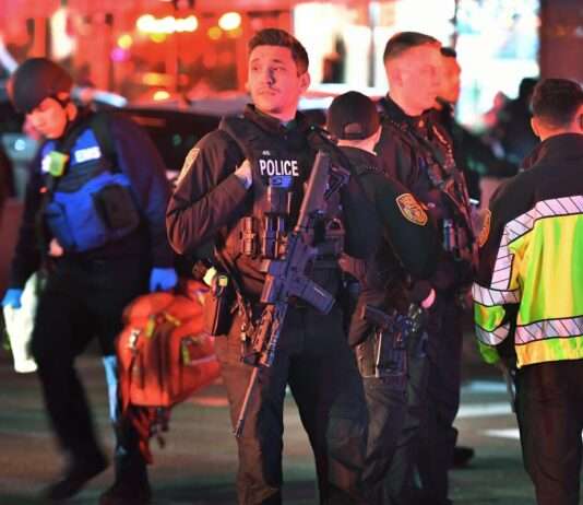 Two killed in U.S. Ivy League campus shooting as manhunt continues Law enforcement agents at the scene of the shooting